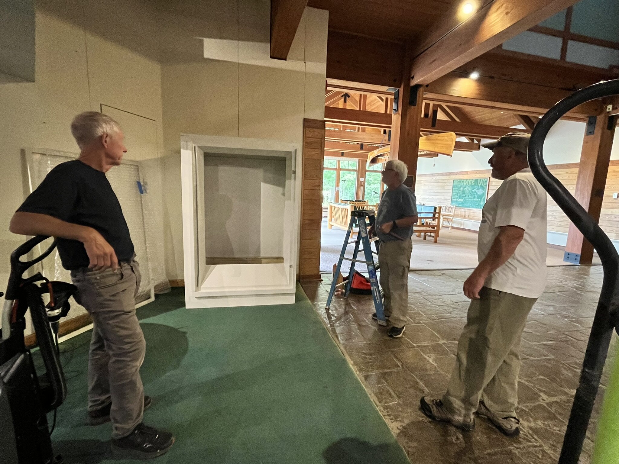 Tom, Jack and Rich setting up display case 8.19.2025