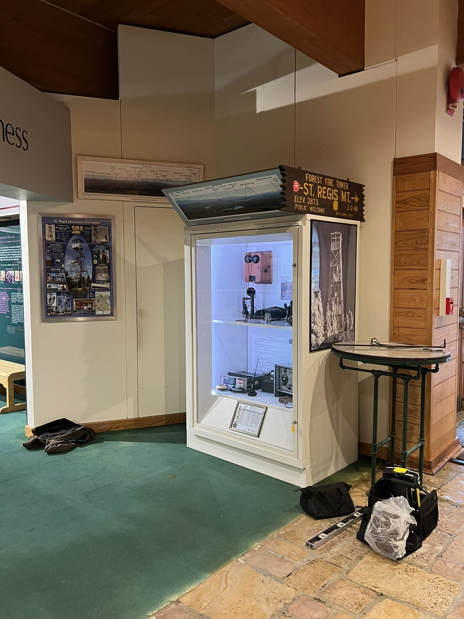 Poster, panel of view from tower, display case and Obsorne Fire Finder table