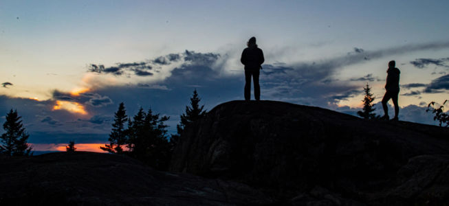 Friends Dawn and Kelly watching sunset from summit St Regis Mt.