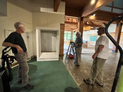 Tom, Jack and Rich setting up display case 8.19.2025
