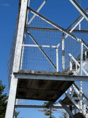 New fence on railing side of first landing