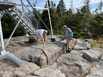 Tom and Bob preparing fence sections for stairway