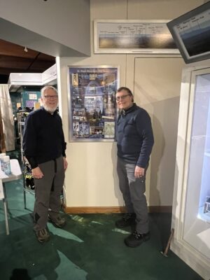 Jack and Doug after putting up new poster. 2.18.2026