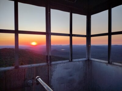 Sunset on August 2nd 2025 framed by the fire tower.