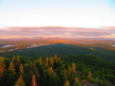 The shadow of St. Regis Mountain seen over the valley and lakes below.
